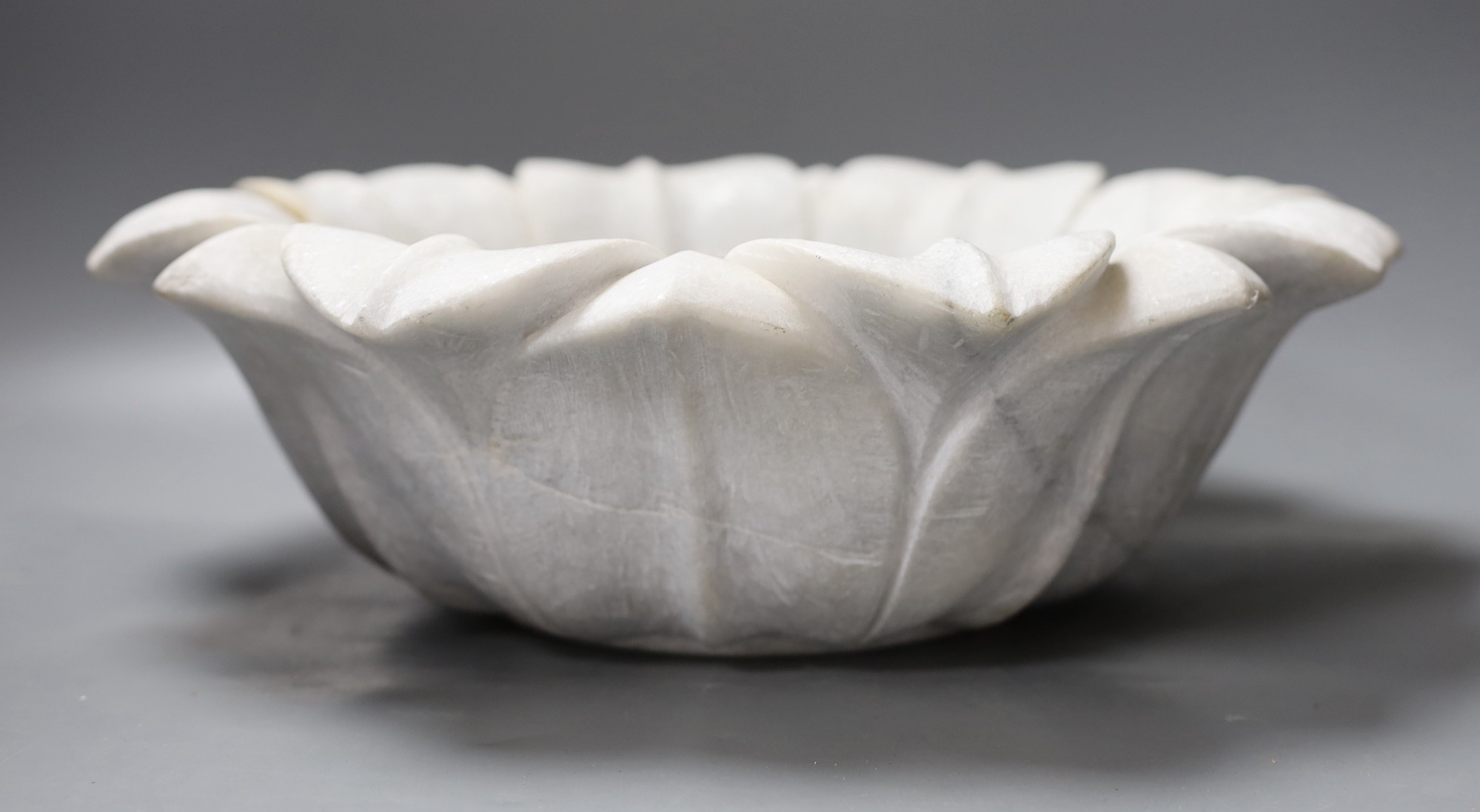 An Indian carved marble lotus flower bowl - 38cm diameter